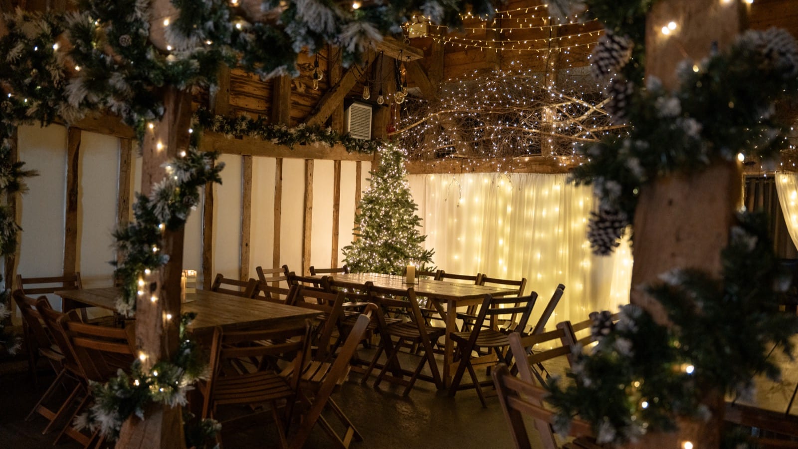 The Apple Barn decorated with a Christmas tree and fairy lights