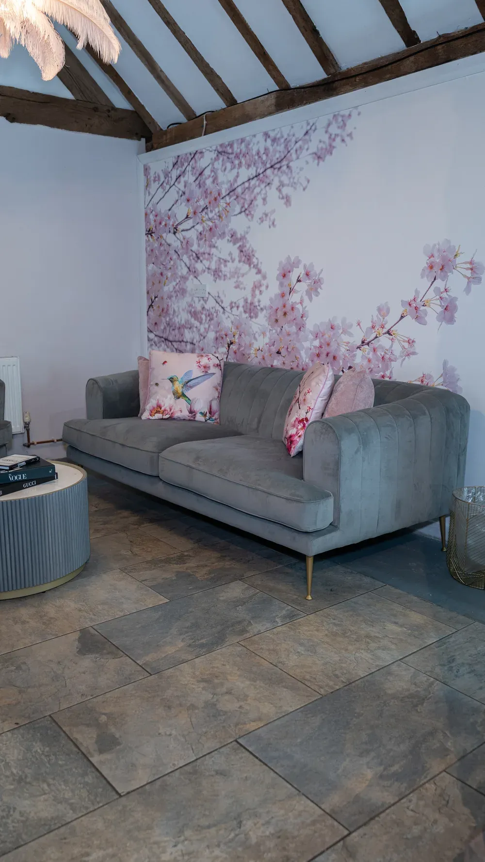 Soft seating and blossom wallpaper in The Blossom suite