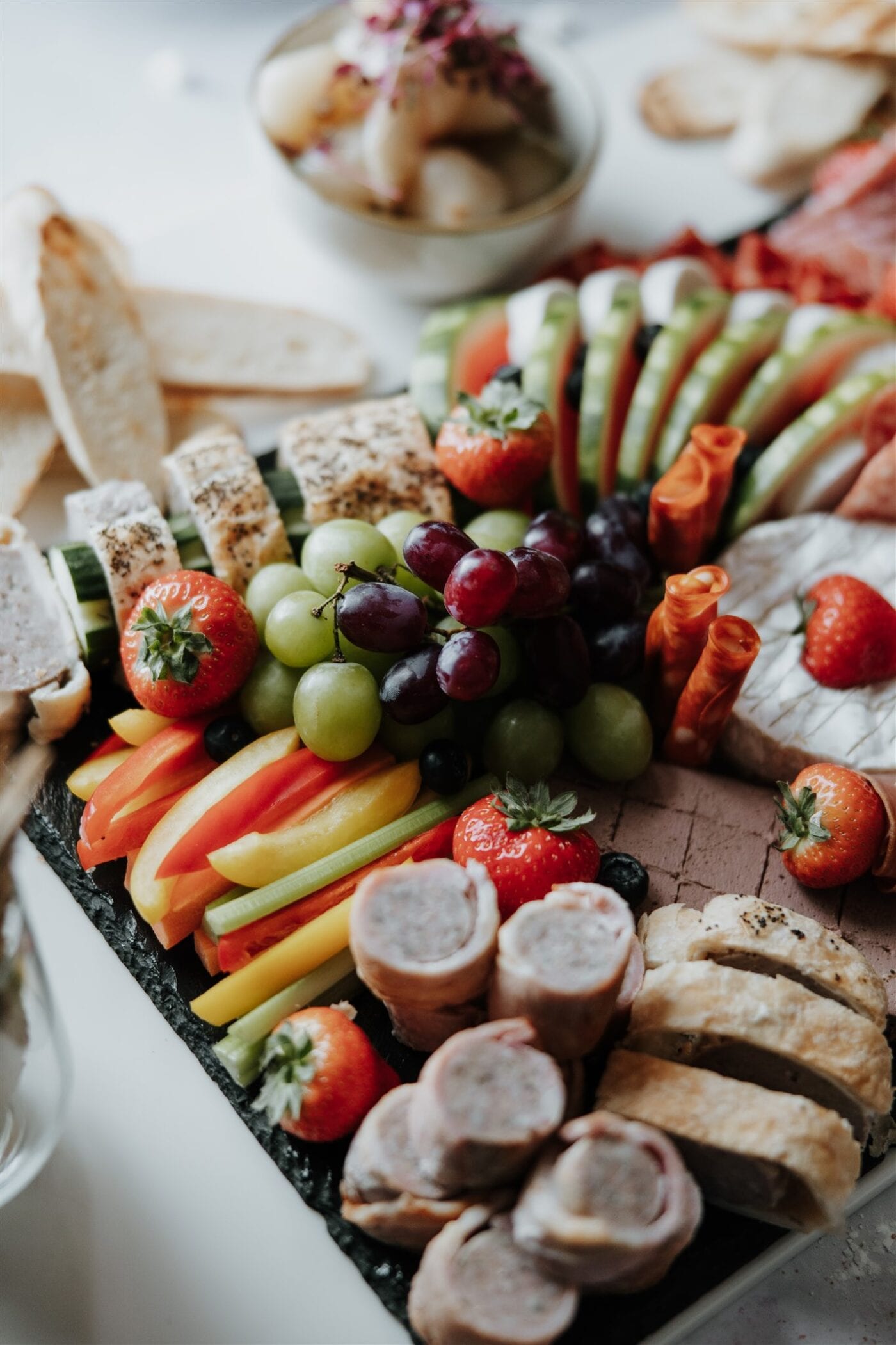 A generous grazing board of charcuterie, cheese, fruit and savoury treats to share at The BarnYard