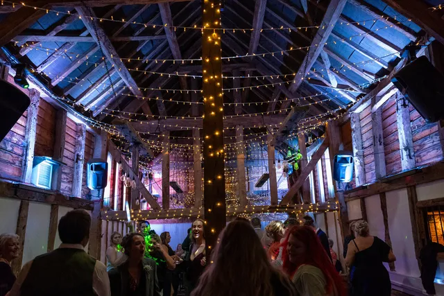 The Apple Barn under blue and purple lighting as guests dance