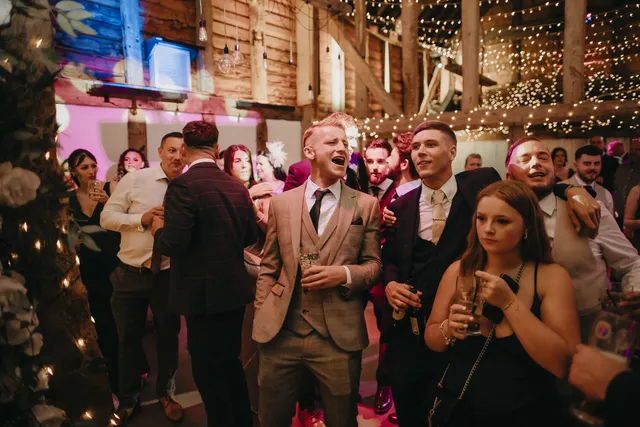 Guests raise a toast at an Apple Barn evening reception