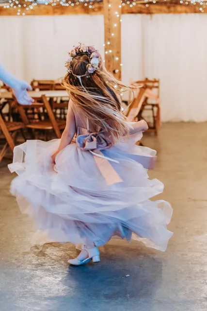 A bride twirls her dress inside the Apple Barn