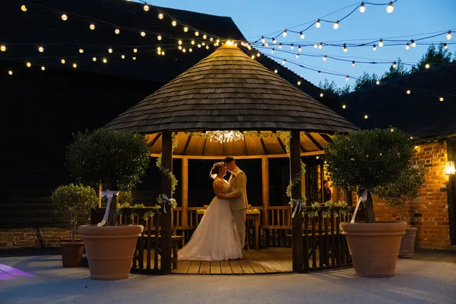 A couple dance alone in the Courtyard gazebo at dusk