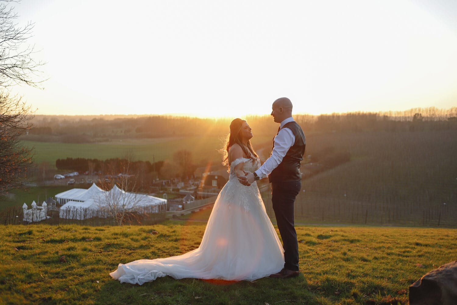 A couple outside the Arboretum at sunset