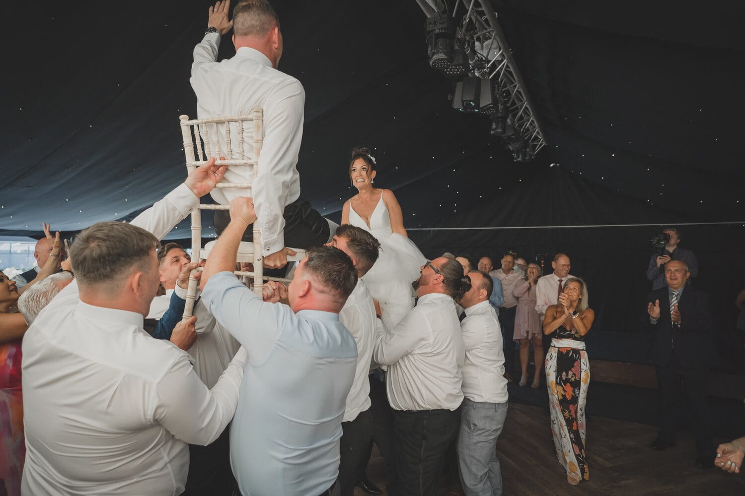 Guests dancing under the fairy lights