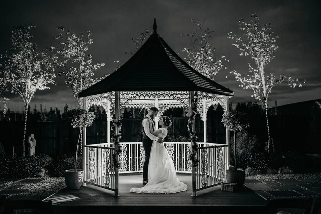 A couple at the gazebo in black and white