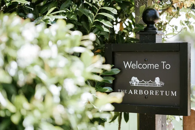 The Arboretum welcome sign among the greenery