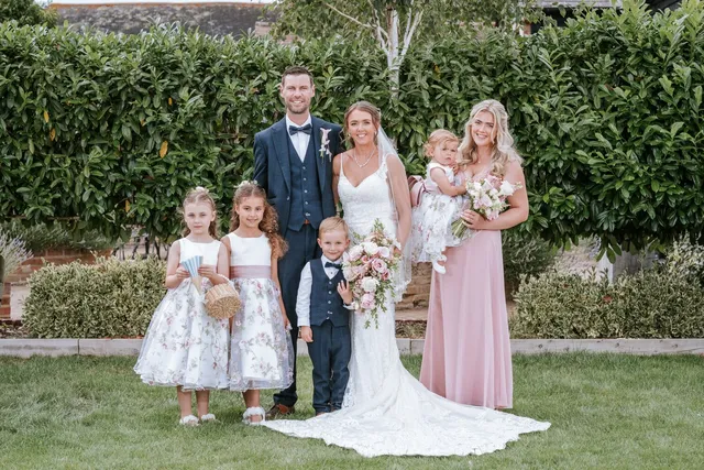 A wedding party with the children in the orchards