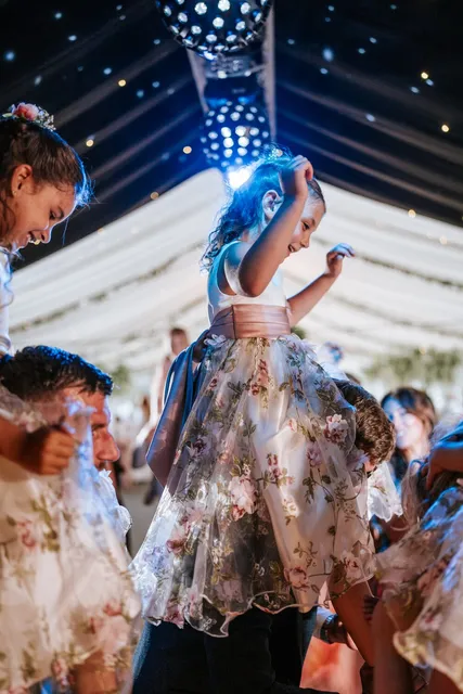Children dancing under the lights