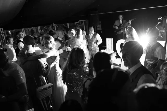 Guests dancing in front of the LOVE letters