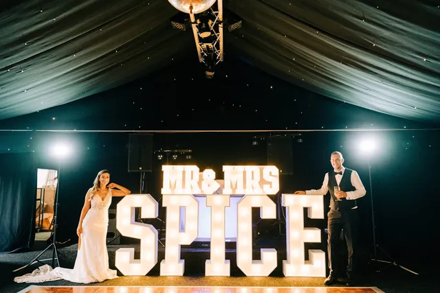 Illuminated Mr and Mrs Spice letters on the stage