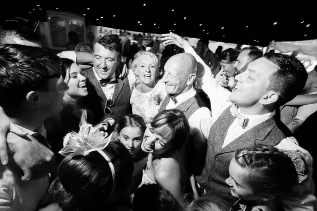 Guests dancing together in black and white