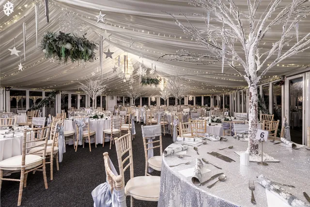 Frosted white trees and snowflakes above the tables in the Arboretum