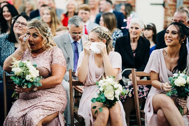 A guest wipes away a tear during a Courtyard ceremony