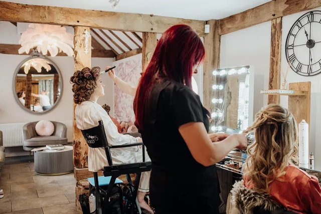 A stylist working at the dressing suite station