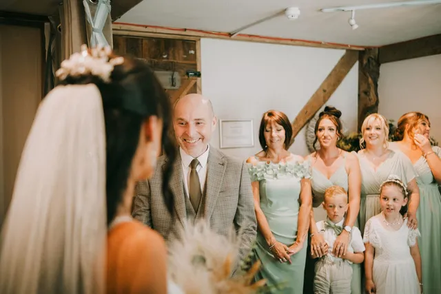 A father and the bridal party sharing a moment before the ceremony