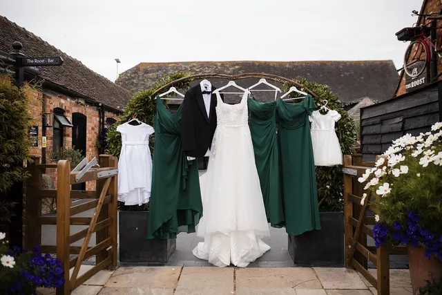 The wedding dress and bridesmaid dresses hung ready