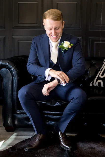 A groom waiting on the Chesterfield in The Hyde Out