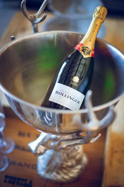 A bottle of Bollinger chilling in a silver bucket