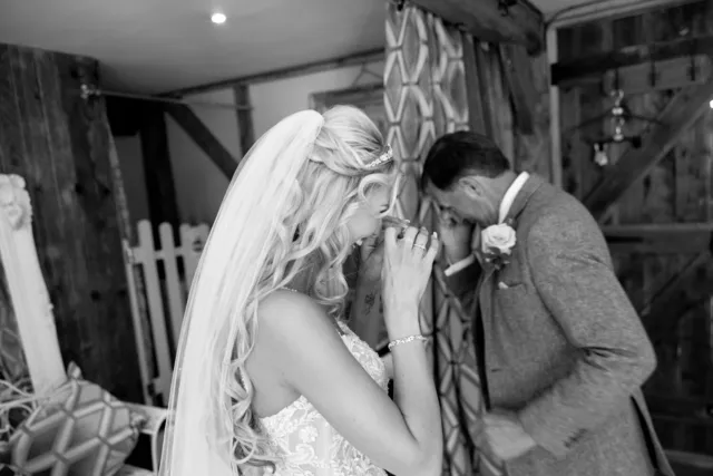 A bride and her father sharing a quiet moment