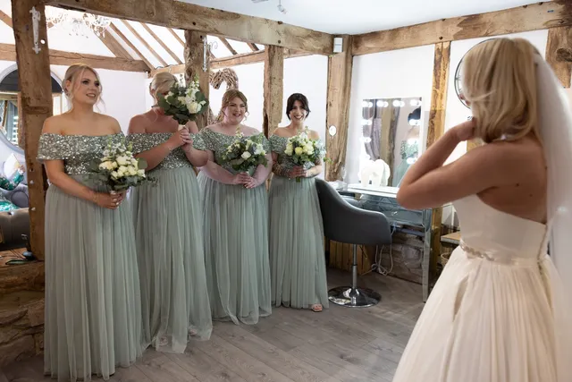 The bridal party gathered in the dressing suite
