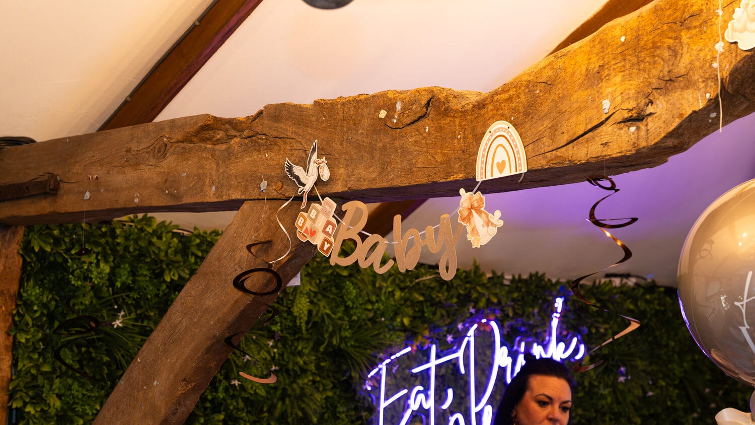 A neon sign lighting up a party