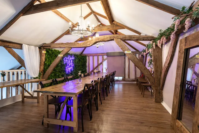 The Roost dressed with greenery and a long table for a party