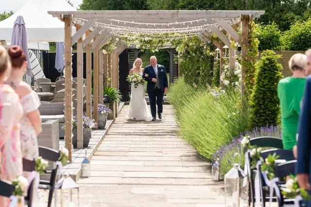 The lavender lined aisle dressed with lanterns