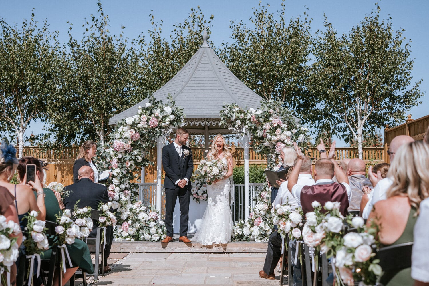 Confetti as a couple walk back down the lavender walk