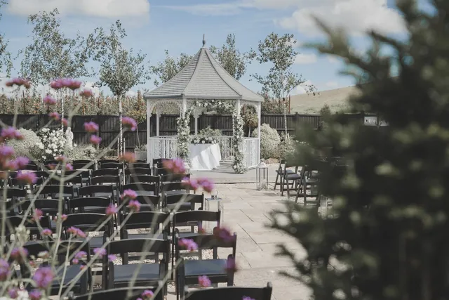 Chairs set for a ceremony at the gazebo
