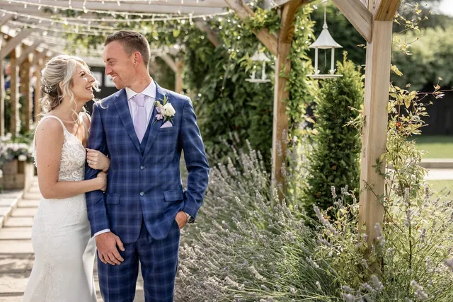 A groom waiting at the top of the aisle
