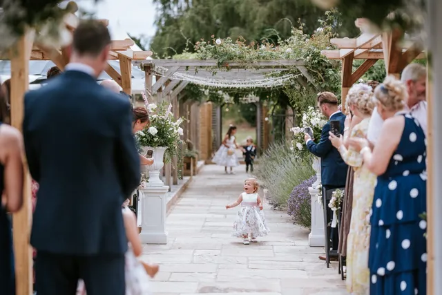 A pageboy walking the lavender aisle
