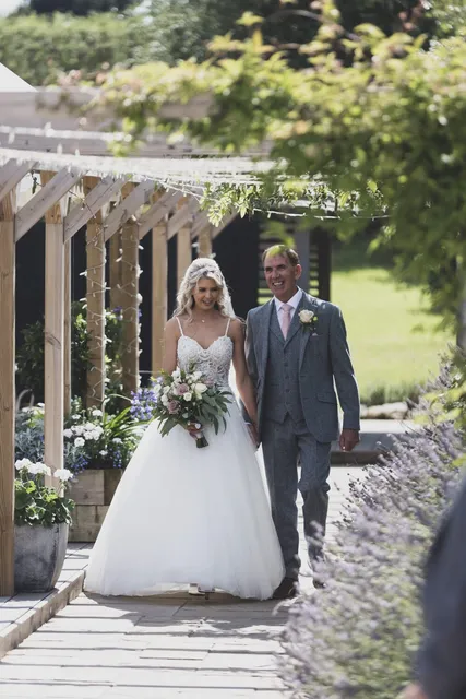 A bride arriving on her father's arm