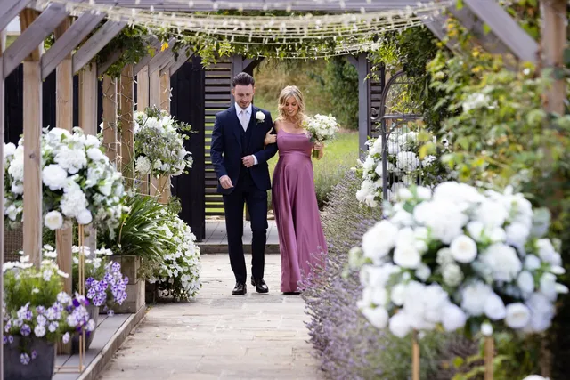 A couple walking the lavender aisle together