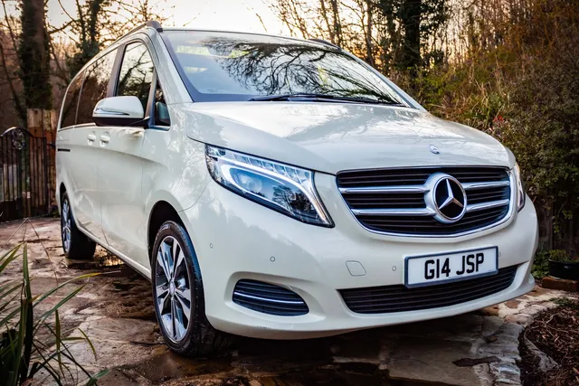 The front of a white Mercedes V-Class chauffeur vehicle