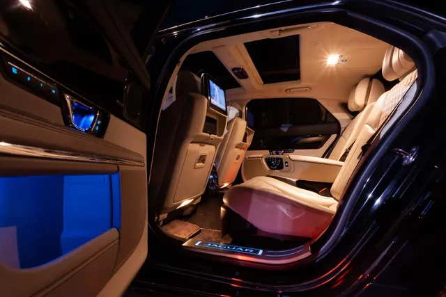 The cream leather interior of a luxury chauffeur car