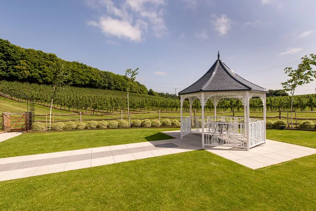 The white gazebo and lawn in the Orchard Garden