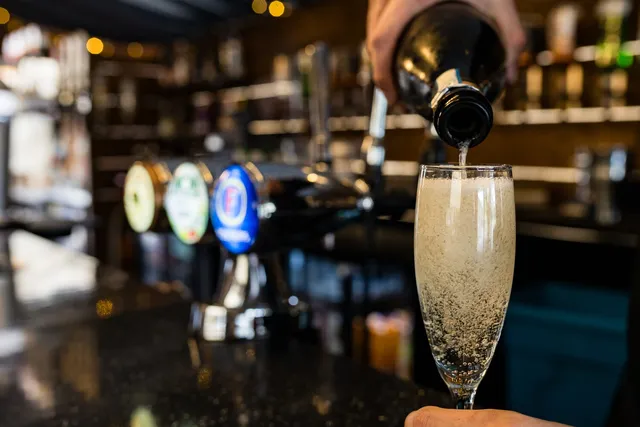 Prosecco being poured at the bar taps
