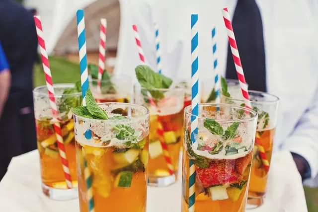 Pimms glasses filled with fruit and mint for a summer welcome