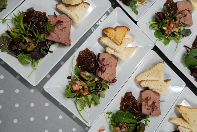 A plated pate starter with toast and chutney