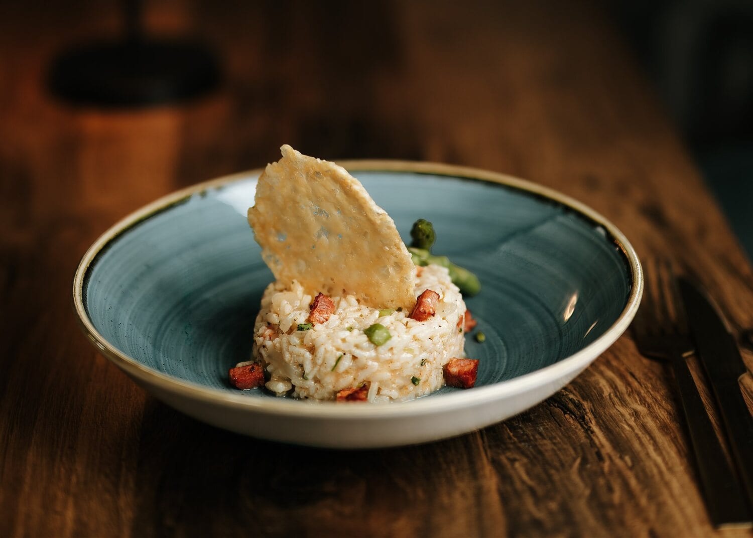 A risotto plated with roasted cherry tomatoes