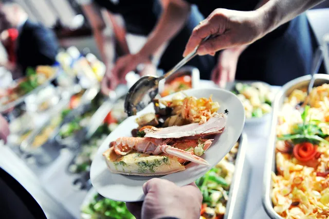 A seafood platter being served at the table
