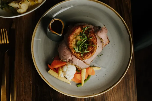 A roast dinner with a Yorkshire pudding