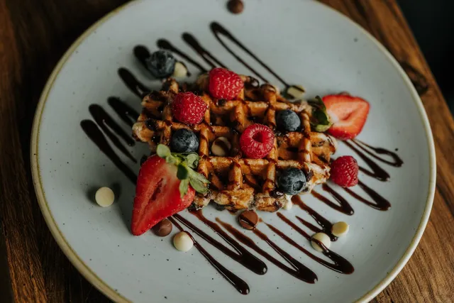 Waffles from above with fruit and chocolate