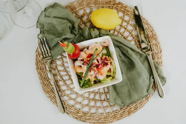 A prawn cocktail starter on a woven mat