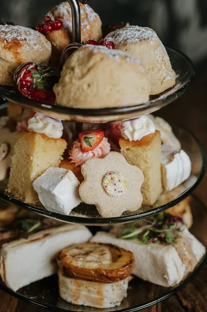 An afternoon tea stand with cakes and meringues