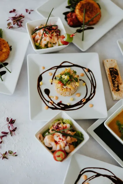 Plated starters set out on a laid table