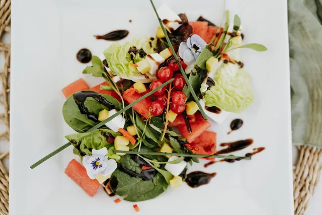 A summer salad with watermelon and pansies