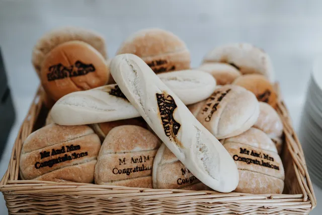 Branded BarnYard bread rolls in a basket