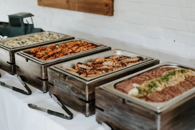 Chafing dishes lined up for a buffet